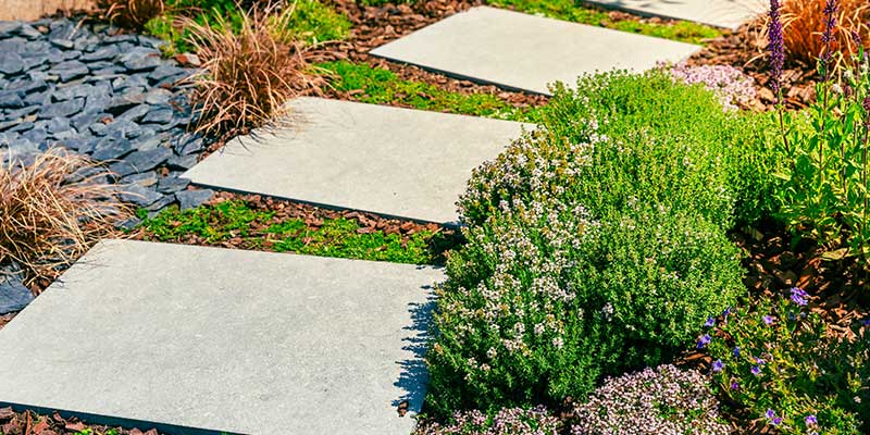 Large Stepping Stones Laid Level With The Grass Create
